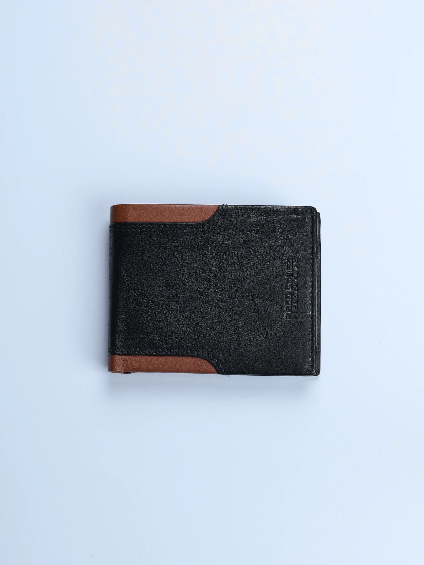 Cartera vertical de piel con laterales en contraste · Negro · imagen 1